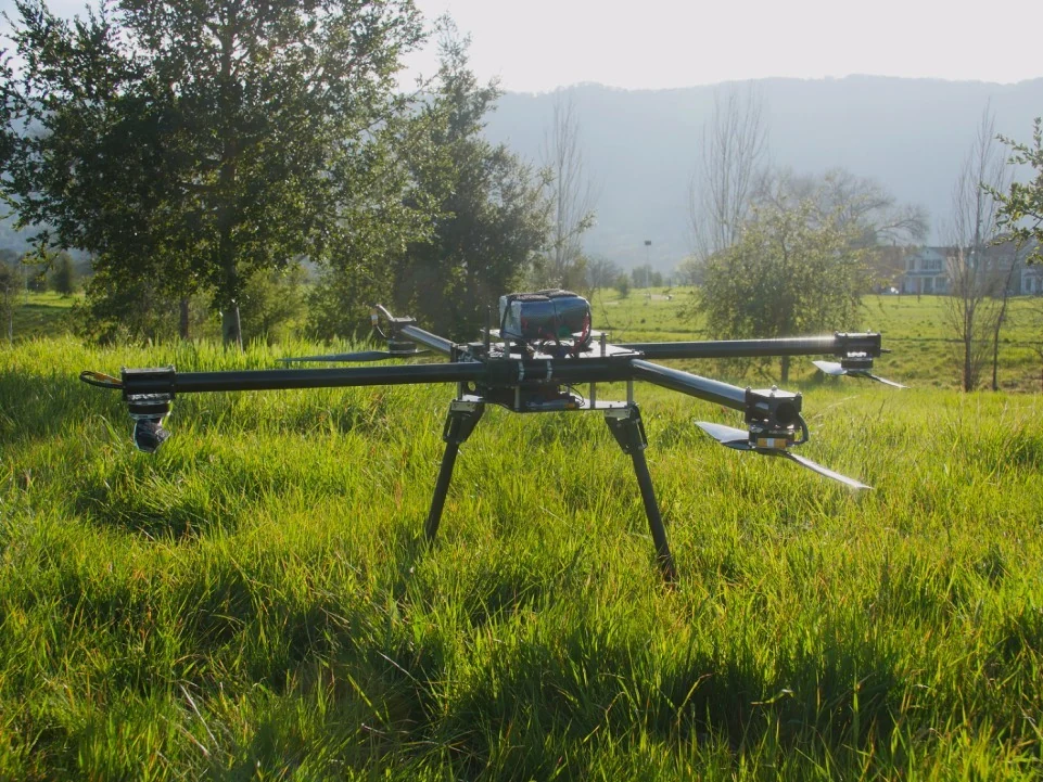Boreas multirotor standing in a field, showing its frame, coaxial motor arms, and landing gear