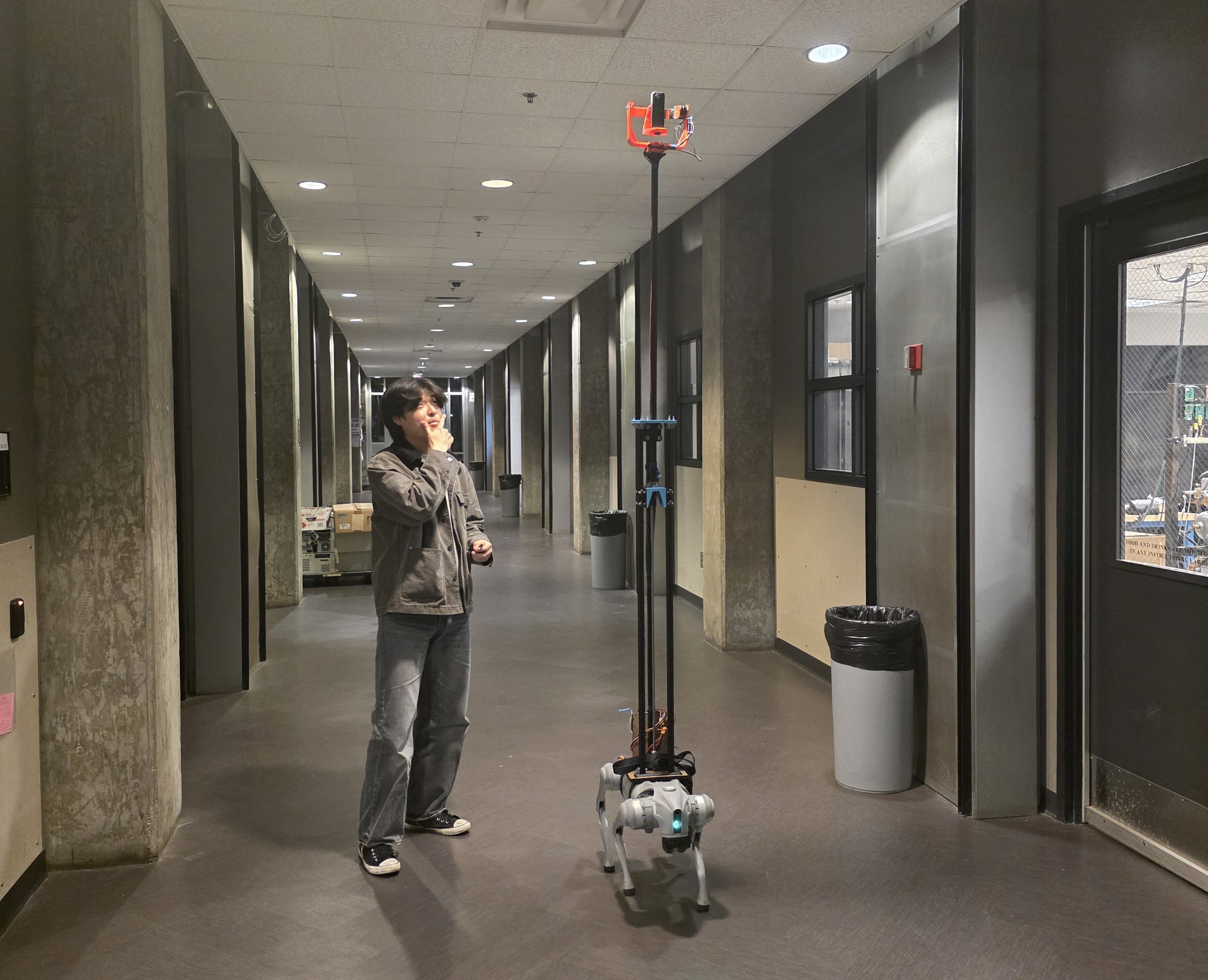 Completed camera rig with extended mast and camera mounted on a quadruped robot