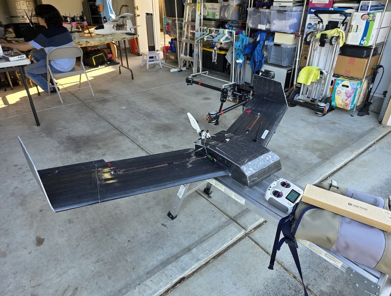 Custom flying-wing survey aircraft on a workshop stand